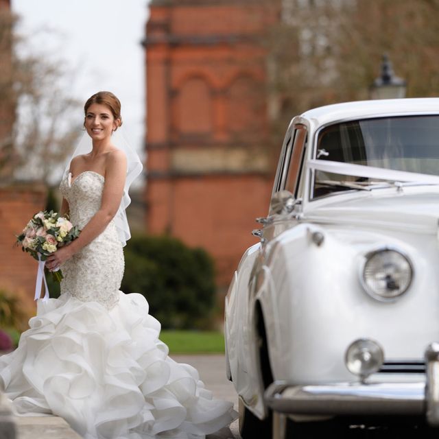 A bride near a car
